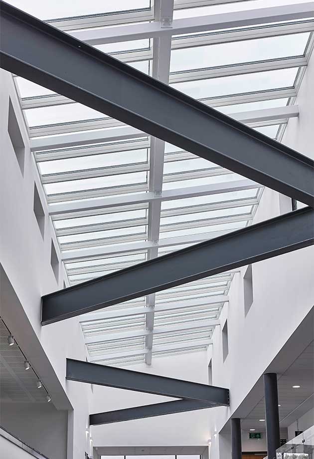 Interior image of Exeter College highlighting atrium solution and support beams.