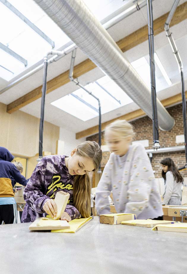 Arts and Crafts - Girls under VELUX Modular Skylights in Peder Lykke School (Copenhagen)