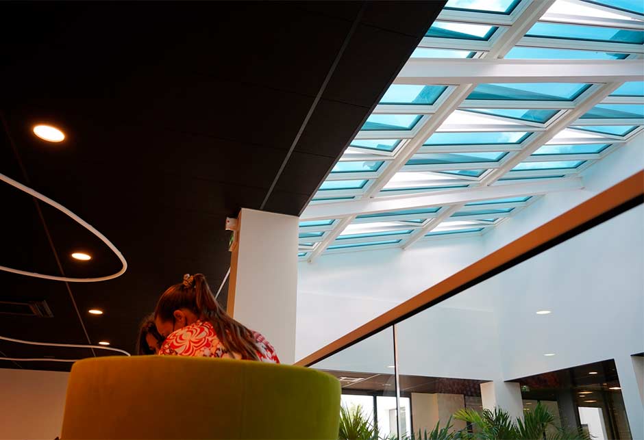 Open VELUX Modular Skylights with and the inside of a bright office space