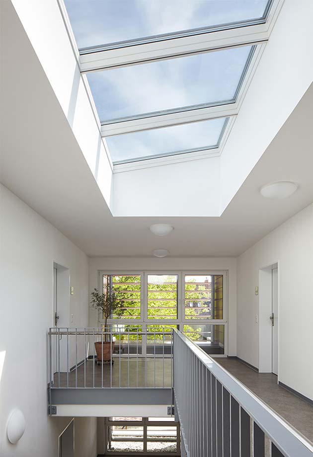 Skylight solution in social housing stairwell with VELUX Modular Skylights - Longlight 5-30°, Hamm, Germany